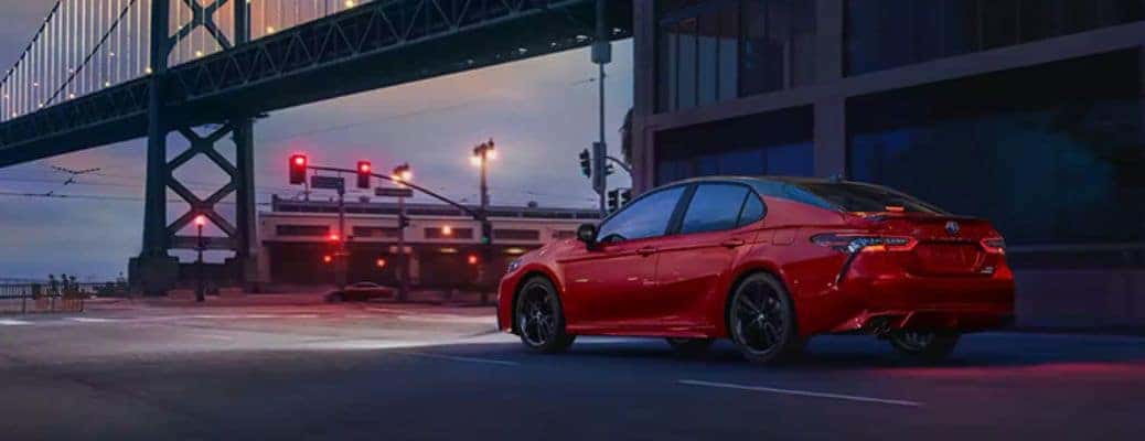 2023 Toyota Camry side and back view under a bridge