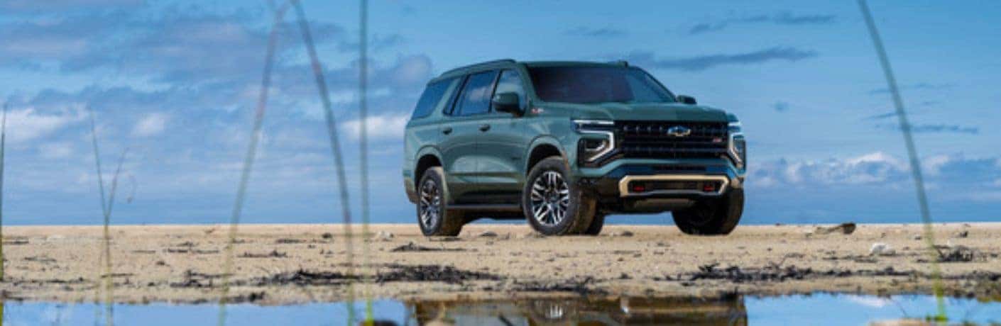 2025 Chevrolet Tahoe side and front view on a beach
