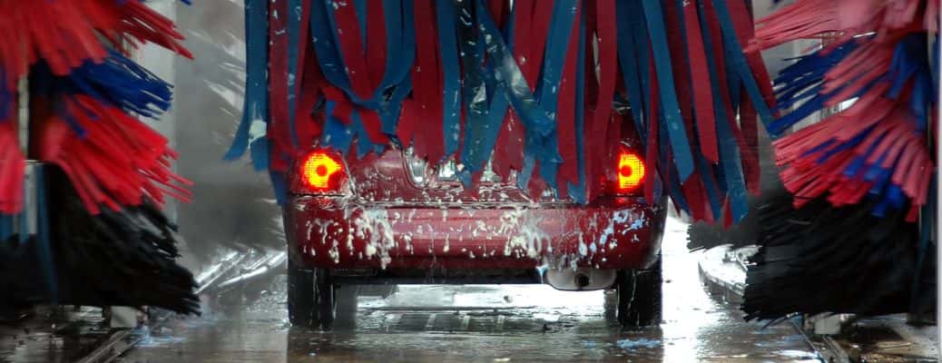 a vehicle passing through an automatic car wash