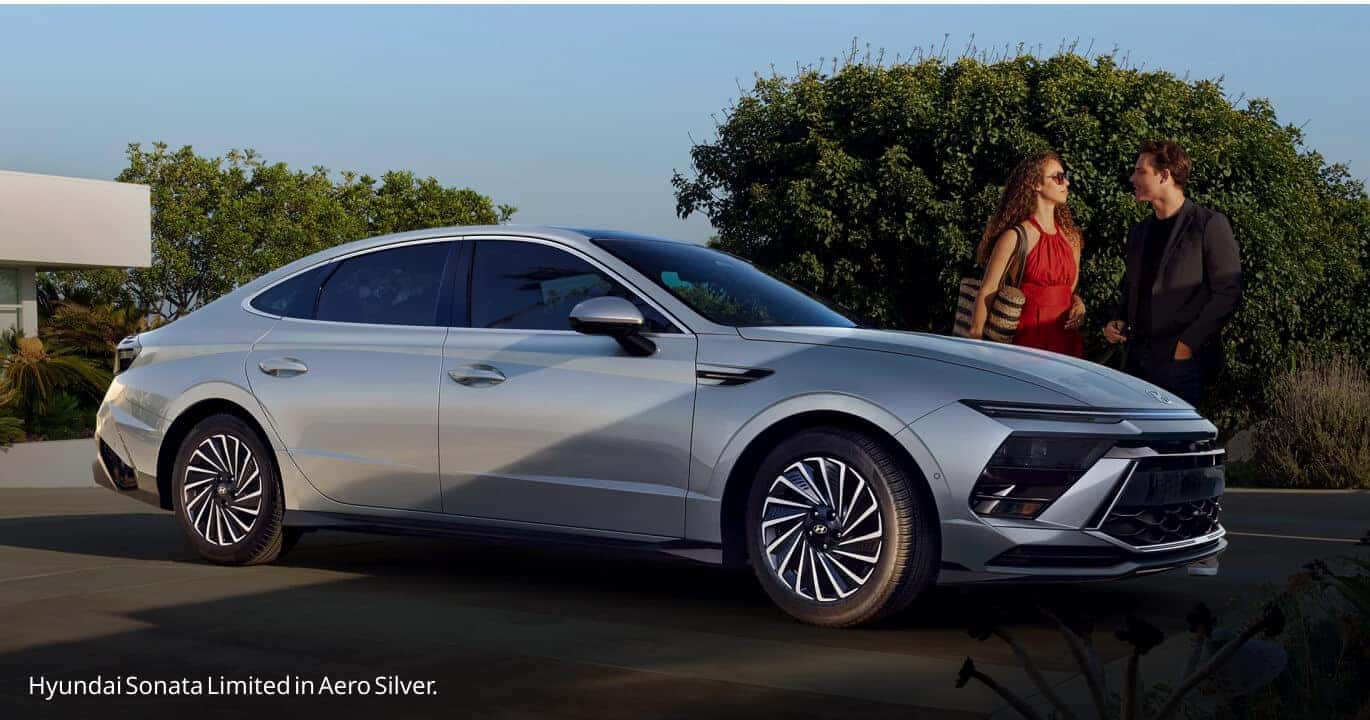 Front three-quarter profile view of an Aero Silver Hyundai Sonata Limited parked on an outdoor driveway.