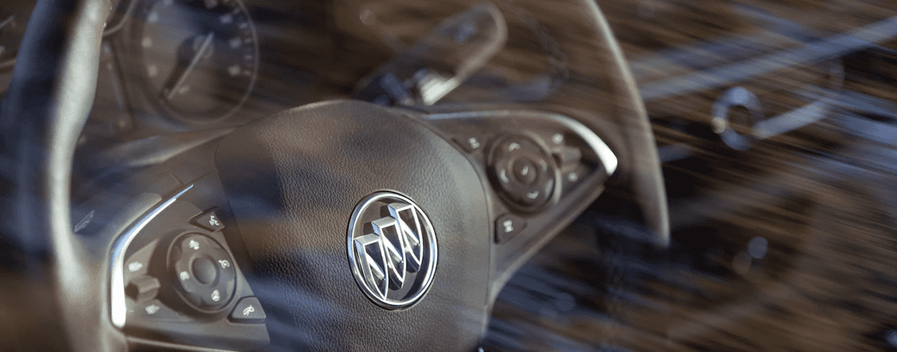 Closeup of 2019 Buick Regal steering wheel through glass