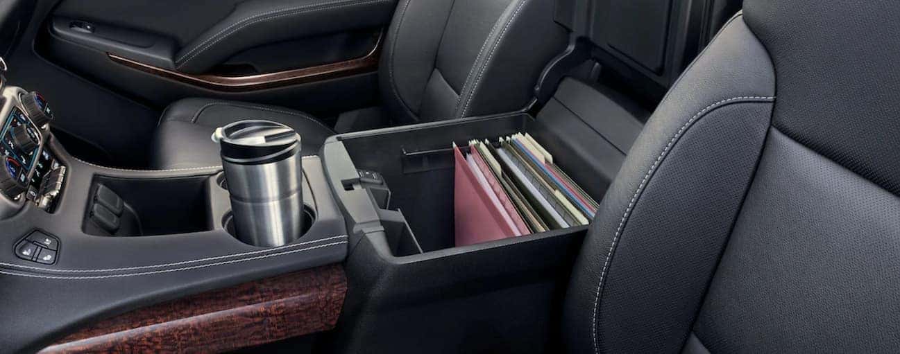 Center console of 2019 GMC Yukon filled with files