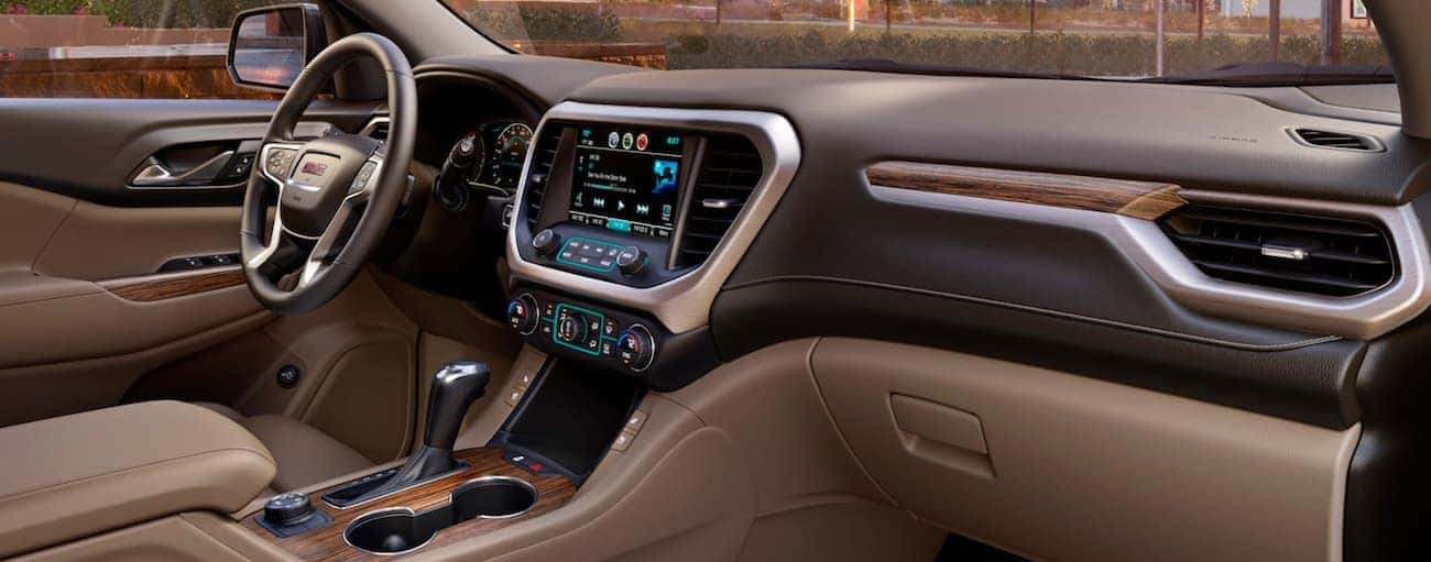 The two-tone brown leather interior of a 2018 GMC Acadia Denali