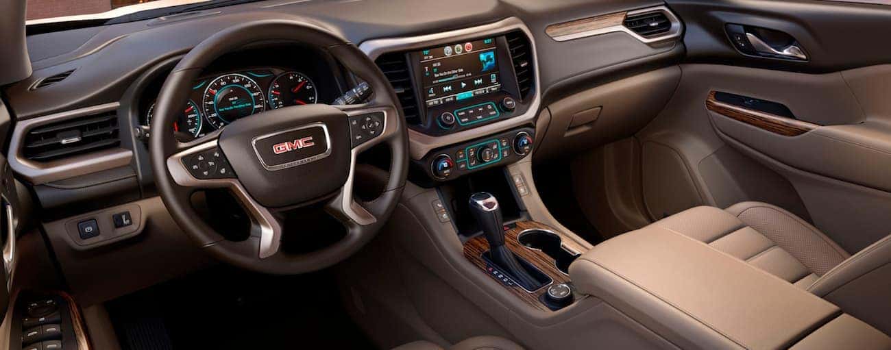 The two-tone brown leather interior of a 2018 GMC Acadia Denali