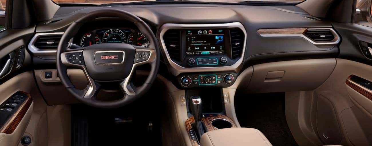 The two-tone brown leather interior of a 2018 GMC Acadia Denali