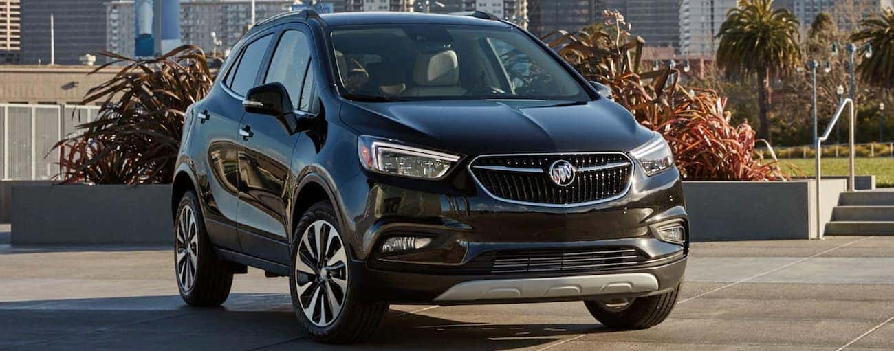 A black 2019 Buick Encore parked in a city