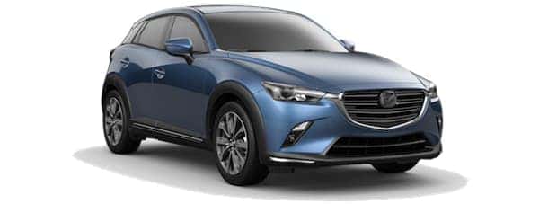 A blue 2019 Mazda CX-3 facing right on white