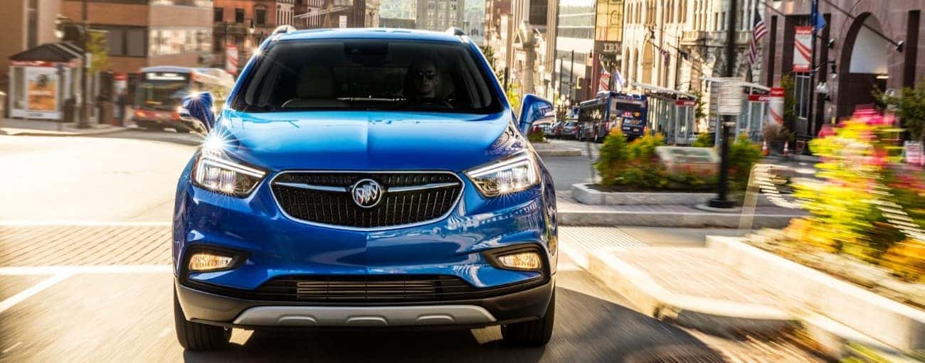 A blue 2019 Buick Encore on a local test drive from a dealer