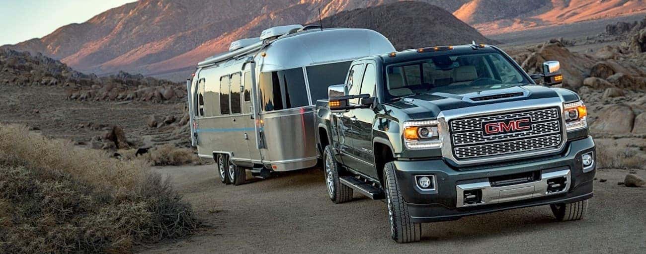 A 2019 GMC 2500HD Denali is towing an airstream trailer. WHen comparing performance for the 2019 GMC Sierra 2500 HD vs 2019 Ram 2500 HD, the GMC wins.