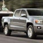 silver 2019 GMC Canyon towing boat