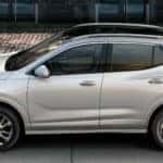 2020 Buick Encore exterior driver side profile parked in front of building with brick sidewalk