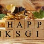 Happy Thanksgiving wood blocks with Autumn squash and corn behind