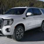 2021 GMC Yukon AT4 Exterior Driver Side Front Profile while Towing