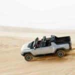 2022-GMC-HUMMER-EV-Exterior-Driver-Side-Front-Profile-Roof-Open_o