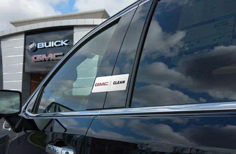 A view of the GMC Buick Logo from behind a car