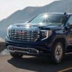 2022 GMC Sierra 1500 Denali Ultimate driving on a road