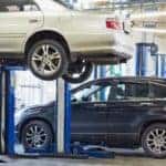 a car in the air in a car service center