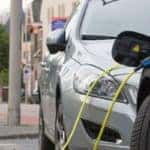 two cars using a public charging station