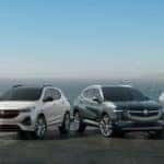 The 2022 Buick lineup of vehicles all parked in front of an ocean view.