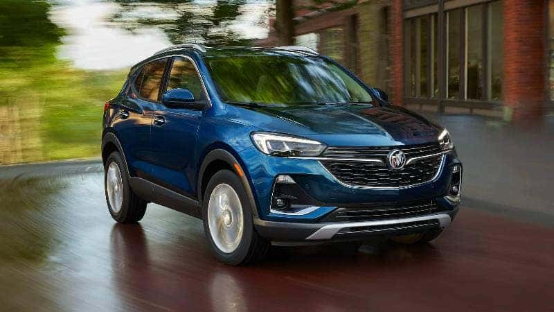 A blue 2022 Buick Encore GX in a showroom.