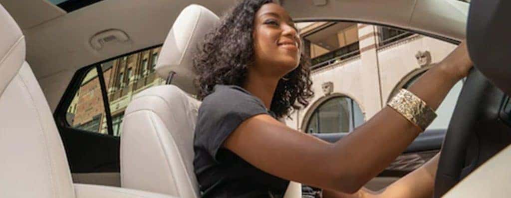 A woman driver in a Buick Envision
