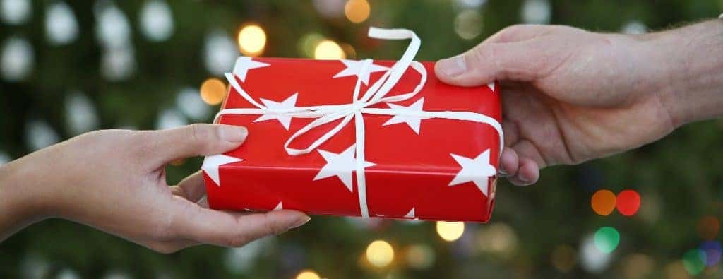 a christmas gift wrapped in red paper