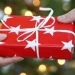 a christmas gift wrapped in red paper