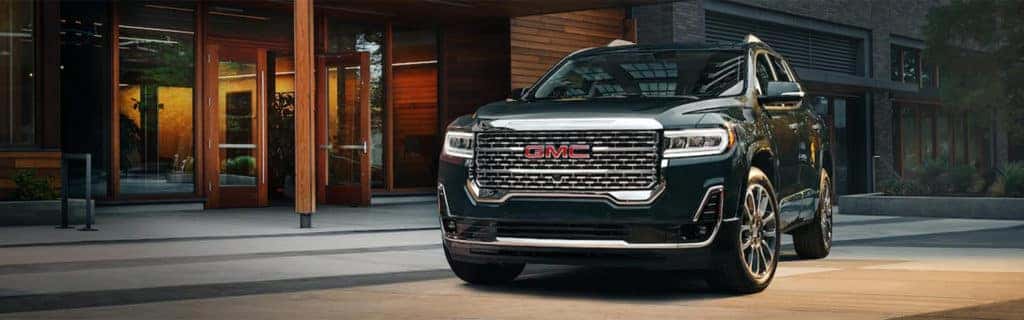 2023 GMC Acadia Denali parked in a city