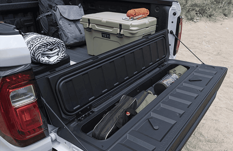 GMC truck bed accessories for loading and securing cargo Carl Black