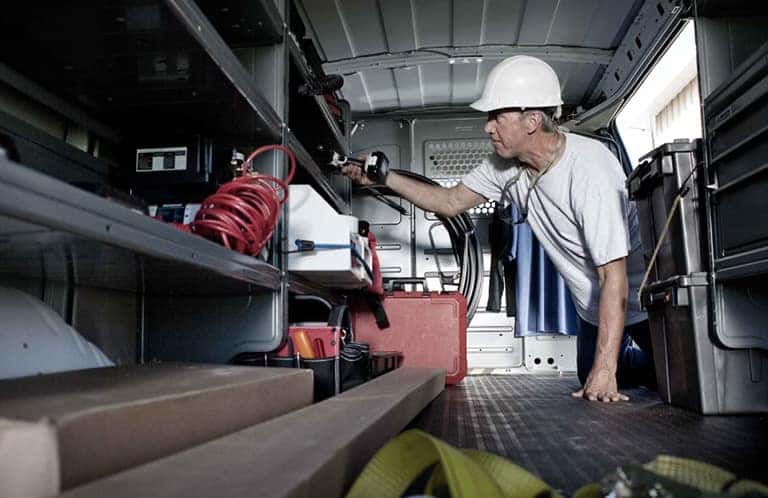 2023 GMC Savana Cargo Van with a man inside