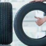 a thumbs up next to a tire
