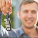 A man holding some car keys