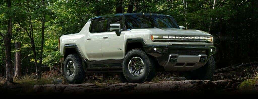 2023 GMC Hummer EV truck in the woods