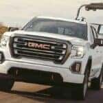 GMC diesel truck towing a boat