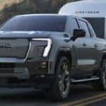 2024 GMC Sierra EV Denali truck towing a trailer