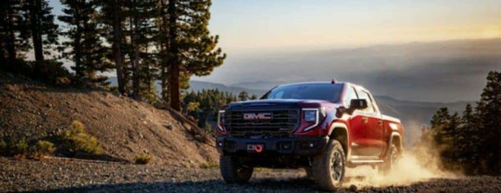 2024 GMC Sierra truck driving on a hill
