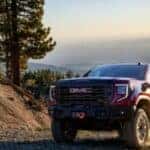 2024 GMC Sierra truck driving on a hill