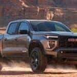 2024 GMC Canyon driving on a dirt road