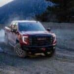 2024 GMC Sierra truck driving through hills