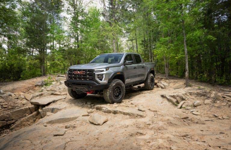 2024 GMC Canyon AT4X truck front view in a forest