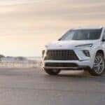 2025 Buick Enclave parked on a beach with white paint