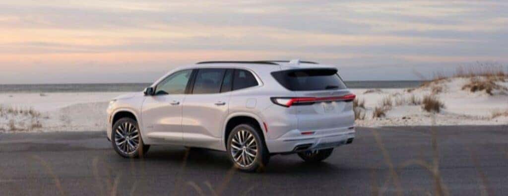 2025 Buick Enclave rear view parked by a beach