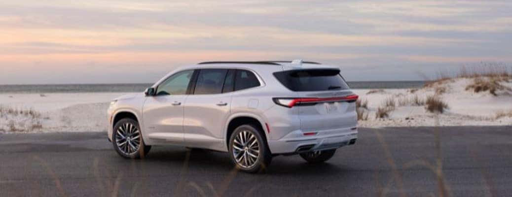 2025 Buick Enclave rear view parked by a beach