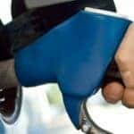 a hand holding a blue gas pump