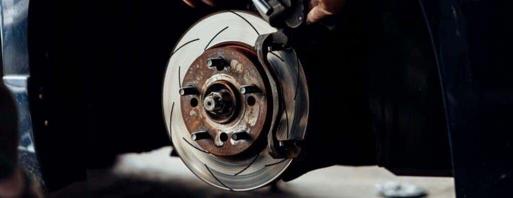 The brakes of a vehicle at a service center close up