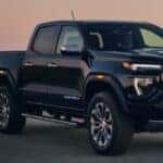 2024 GMC Canyon Denali front view on a road