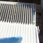 blue hands holding a car air filter