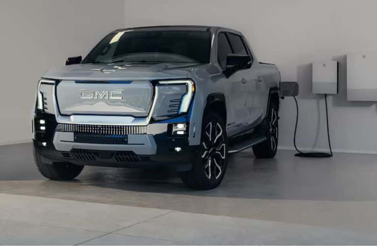 2025 GMC Sierra EV Denali front view charging