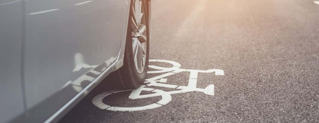 A car tire driving in the bike lane