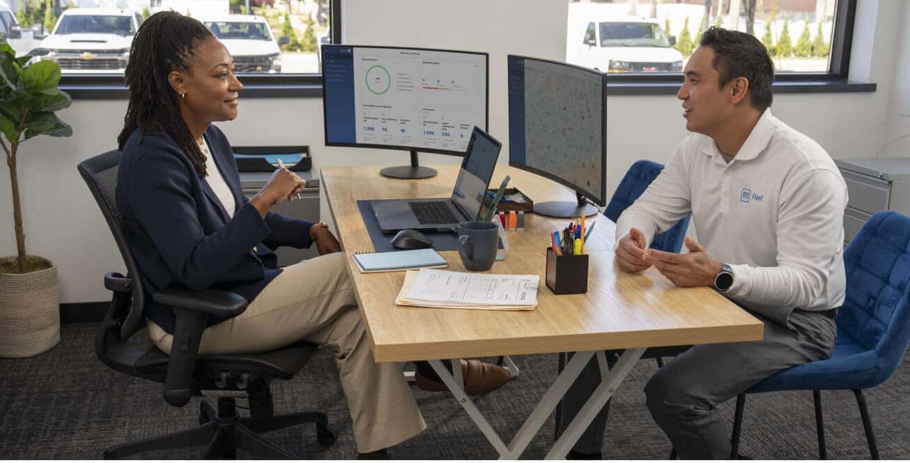  Interior view of a corporate office where an advisor consult over digital asset with employee of General Motors